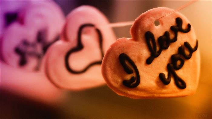 Heart-shaped cookies with "I love you" text