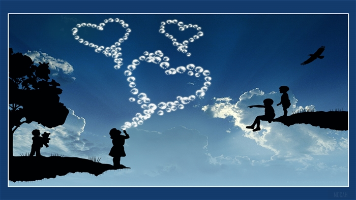 Children blowing heart-shaped bubbles in the sky