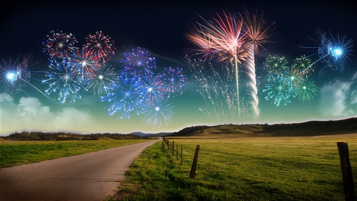 Fireworks over a rural landscape