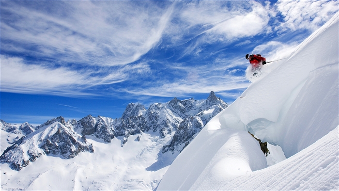 Skier in Red Skiing Down a Snowy Mountain in France 4K