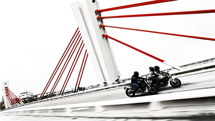 Three Ducati Monsters on a bridge