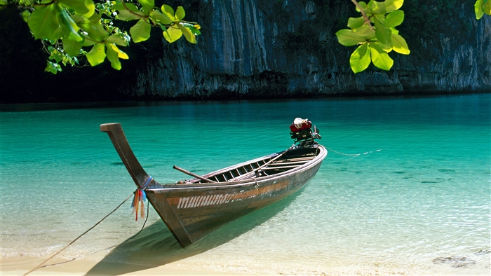 Longtail boat on a tropical beach 4K