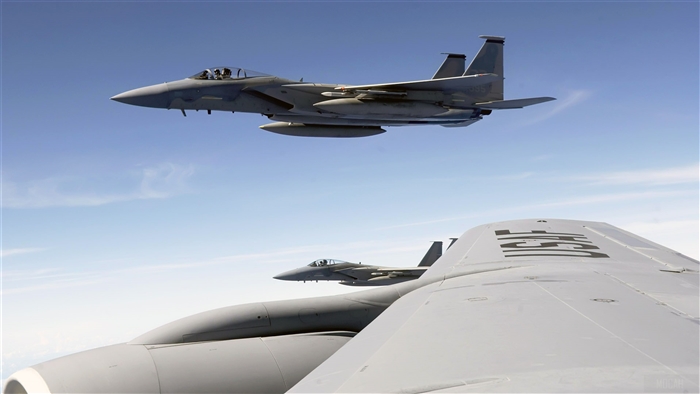 F-15 Eagle jets fly with KC-135 Stratotanker 4K
