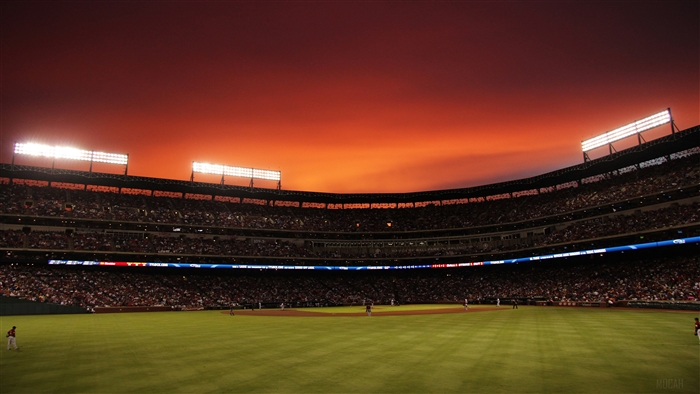 Baseball stadium at sunset with Texas Rangers and Houston Astros
