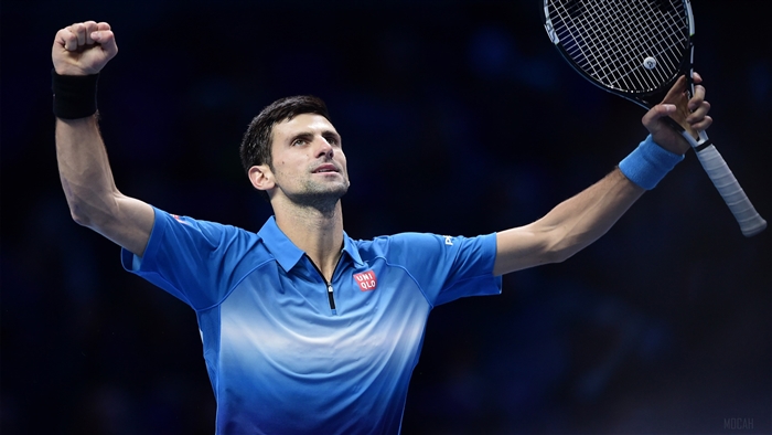 Novak Djokovic celebrating with a tennis racket