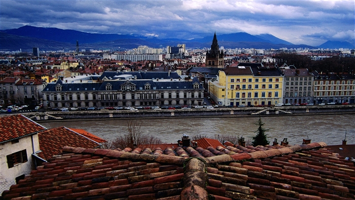 Grenoble, France cityscape with river and mountains