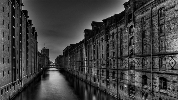 Warehouses along a canal at night