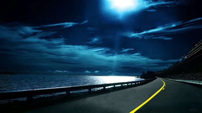 Highway at Night with Ocean and Moon