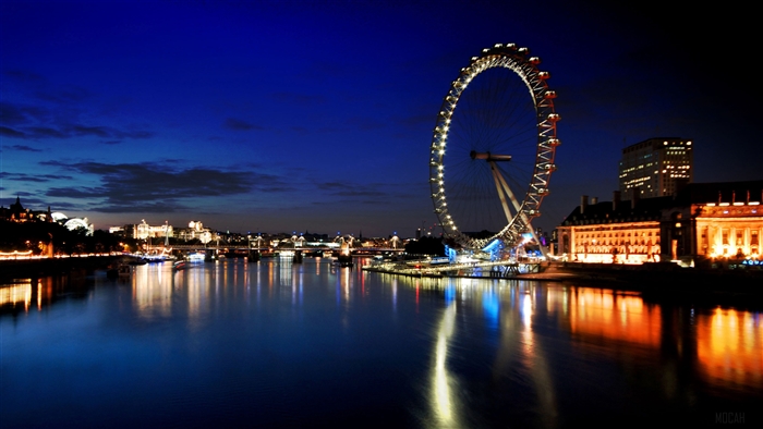 London Eye at night with river reflections