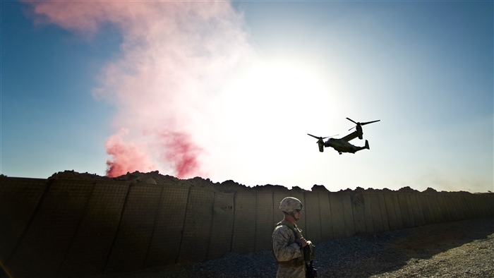 US Marine Corps Osprey and soldier with smoke