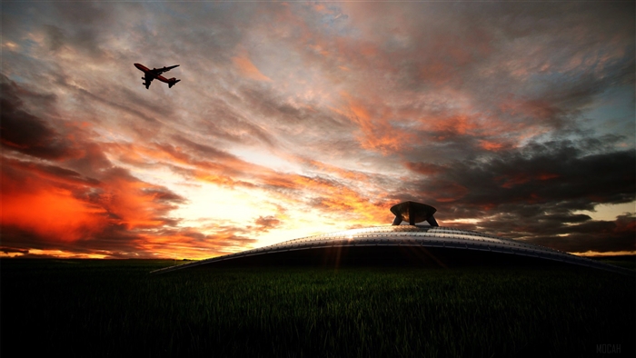 Airplane flying over a futuristic building at sunset