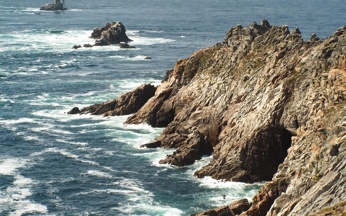 Rocky coastline with waves crashing against rocks