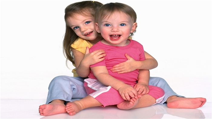 Two young girls smiling