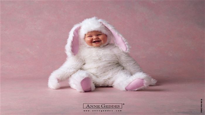 Baby in a white bunny costume