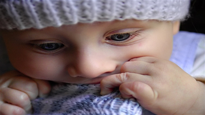 Cute baby wearing a knitted hat