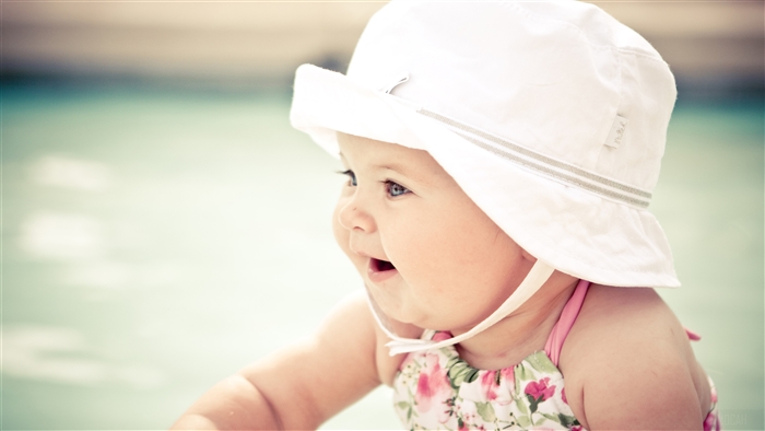 Cute Baby Wearing a White Hat 4K