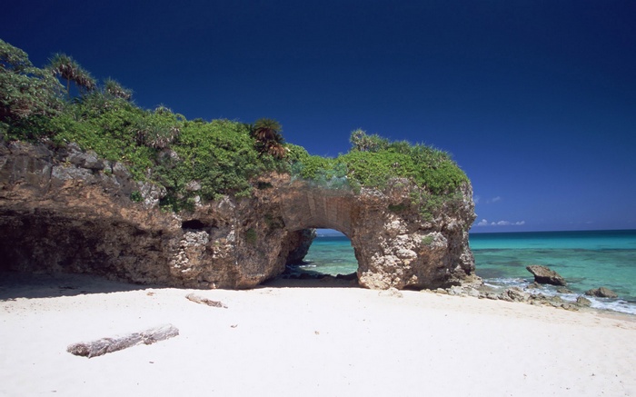 Archway rock formation on a tropical beach