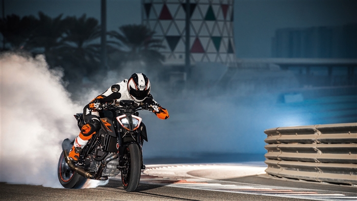 KTM 1290 Super Duke motorcycle performing a burnout