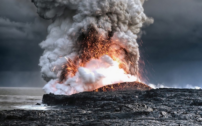 Volcano erupting with lava and smoke