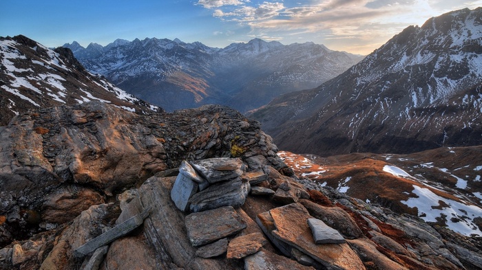 Rocky mountain landscape with snow and valley