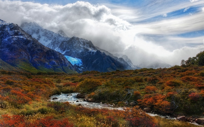 Mountain landscape with glacier and autumn foliage