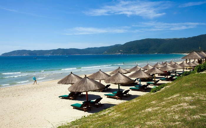 Beach with umbrellas and lounge chairs