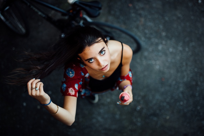 Young woman with blue eyes holding ice cream
