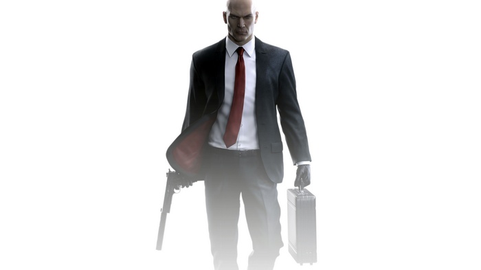 Agent 47 from HITMAN holding a gun and briefcase