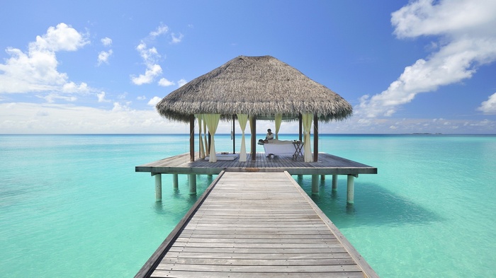 Spa pavilion over turquoise water in the Maldives