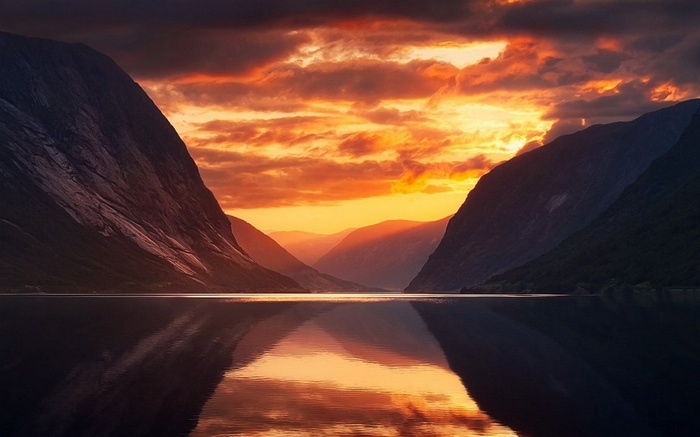 Sunset over a Fjord in Norway with Mountains