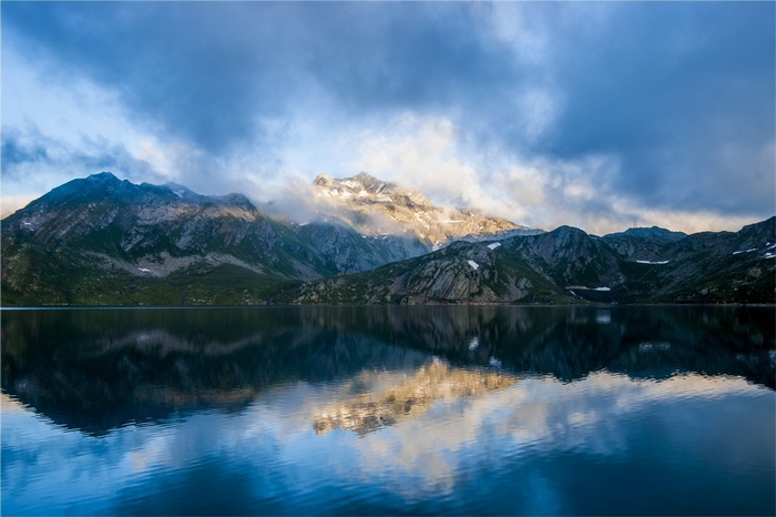 Mountain range reflected in a calm lake