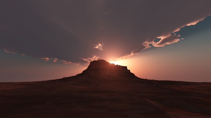 Sunset over a desert mountain landscape
