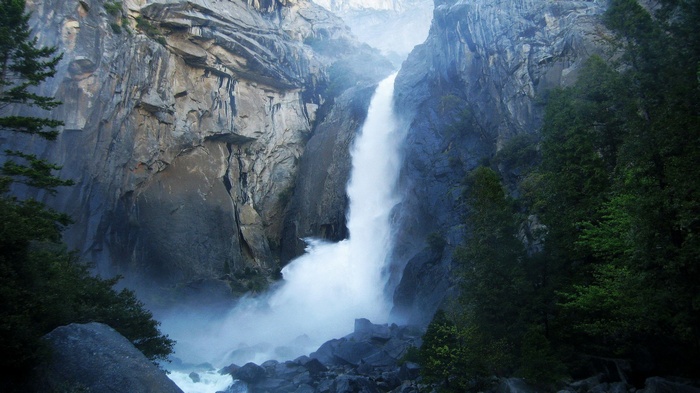 Waterfall cascading down a rocky cliff face