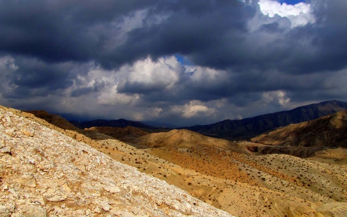Stormy clouds over a desert landscape