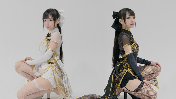 Two Asian women in traditional Chinese dresses
