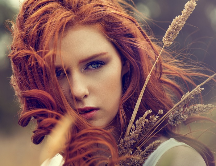 Portrait of a redhead woman with blue eyes