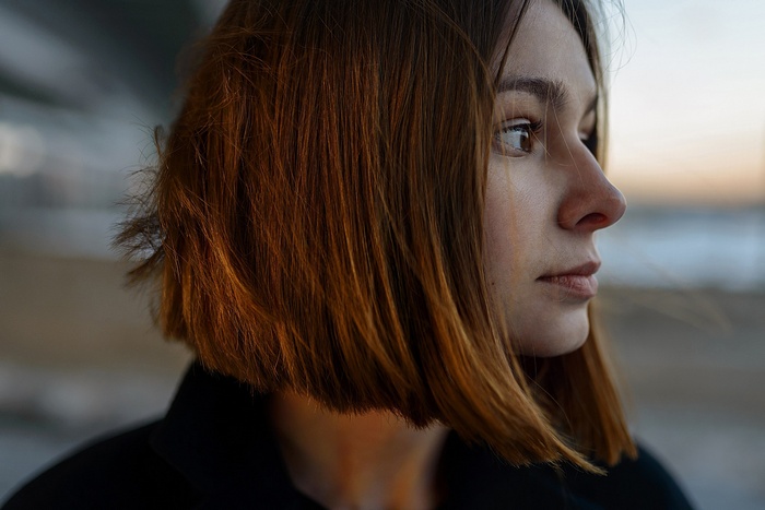 Woman with short brown hair in profile
