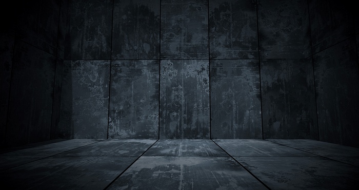Dark metallic room with tiled walls and floor
