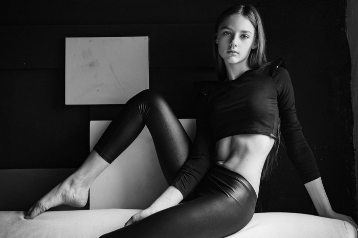 Model in black clothing and leather pants by Aleksey Trifonov