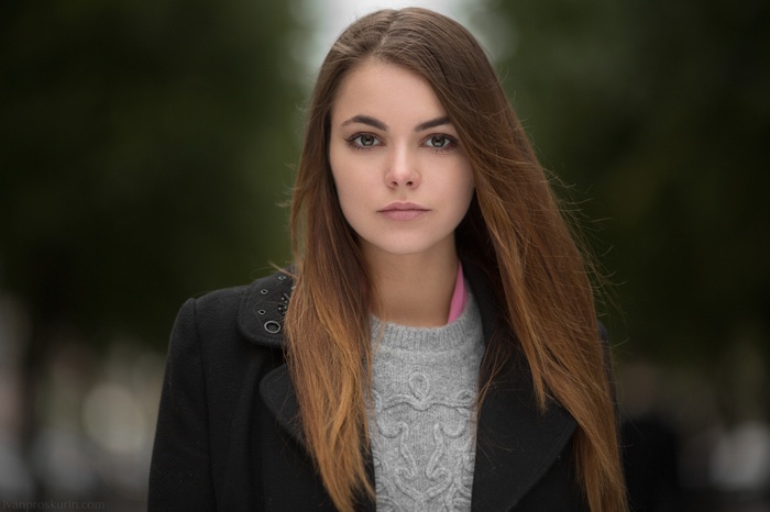 Portrait of a young woman with long brown hair