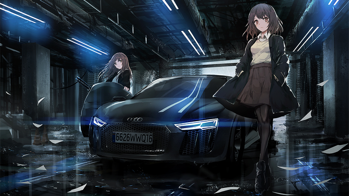 Two brunettes with an Audi R8 in a garage