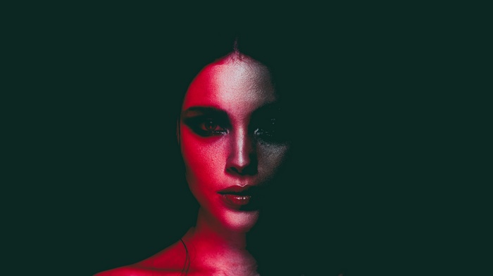 Woman's face with red lighting
