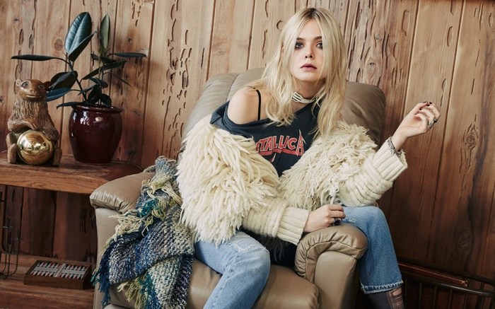 Elle Fanning wearing a Metallica t-shirt and fur jacket