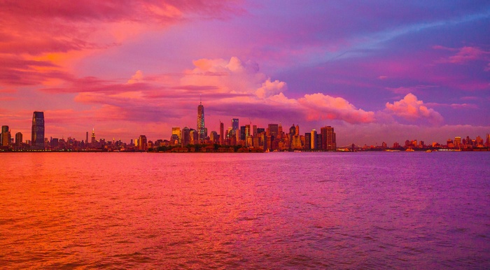 New York City skyline at sunset over water