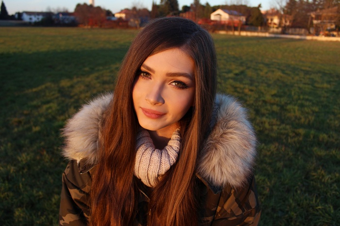 Karina Kozyreva in a fur-lined jacket outdoors