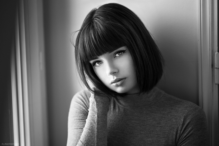 Monochrome portrait of a woman with bangs