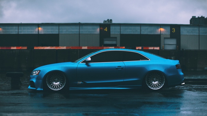 Blue Audi RS5 Coupe on Wet Surface