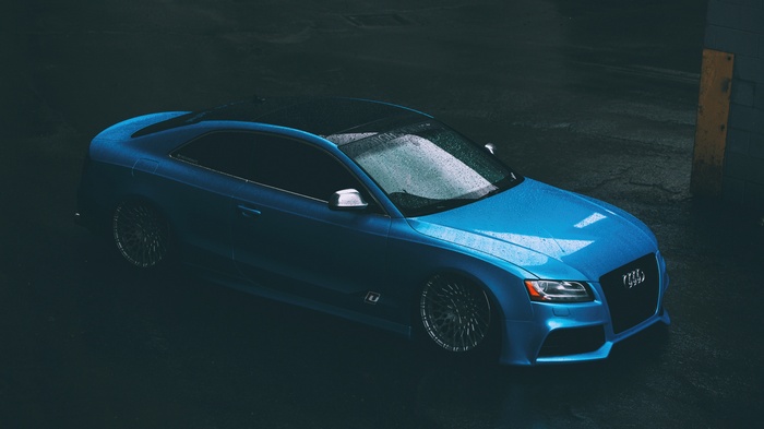 Blue Audi RS5 Coupe on wet asphalt