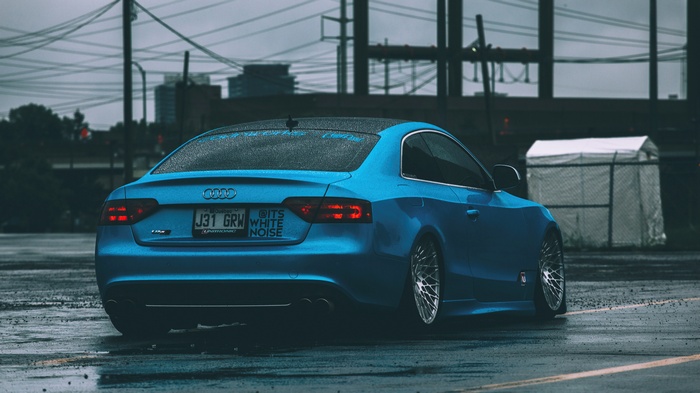 Blue Audi RS5 Coupe on a Wet Road