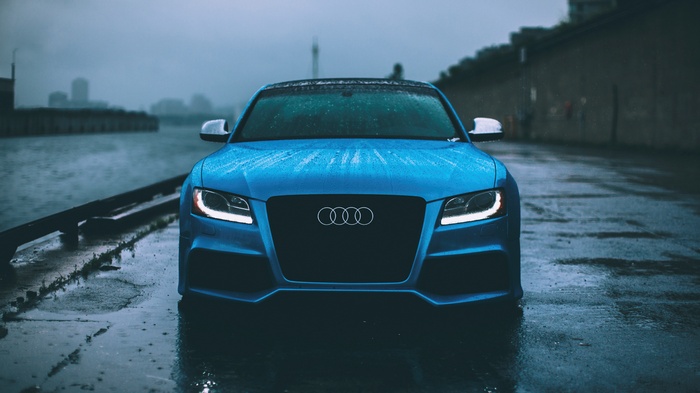 Blue Audi RS5 Coupe on a Wet Road